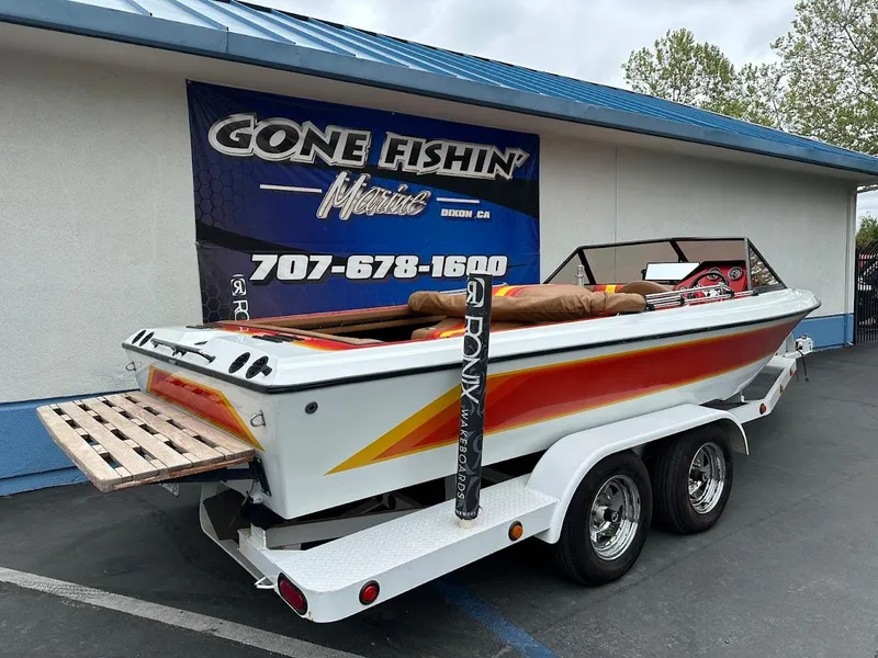 Slide: The Image of 1988 Malibu Skier boat on trailer, parked outside Gone Fishin' Marine store. - 7