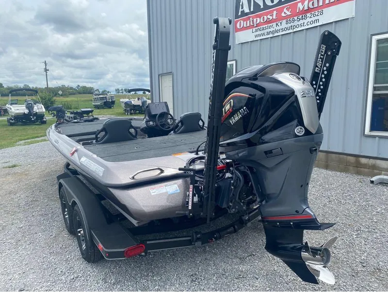 Slide: The Image of 2025 Skeeter ZXR 21 boat with Yamaha engine at dealership, gravel lot background. - 11