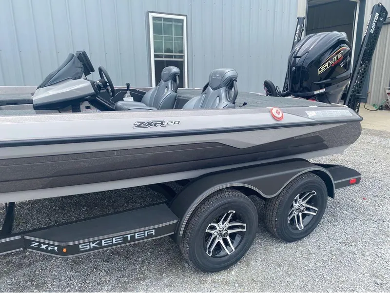 Slide: The Image of 2025 Skeeter ZXR 21 boat on trailer, featuring sleek design and powerful engine. - 5