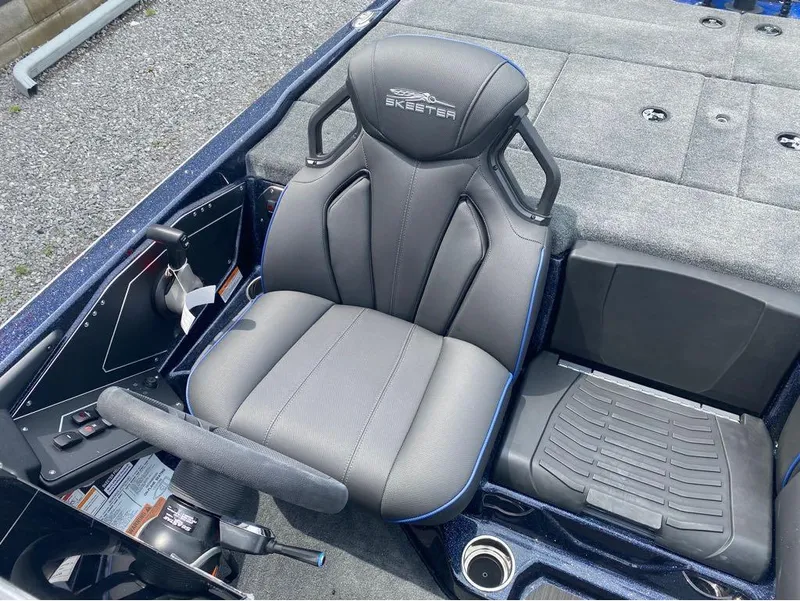 Slide: The Image of 2025 Skeeter ZXR 21 boat interior with sleek seating and control panel. - 10