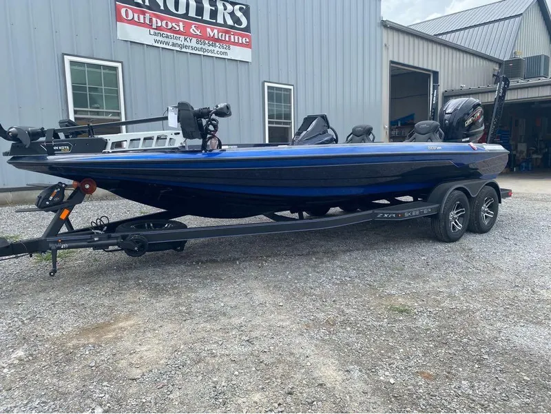 Slide: The Image of 2025 Skeeter ZXR 21 boat on trailer outside Anglers Outpost & Marine. - 4