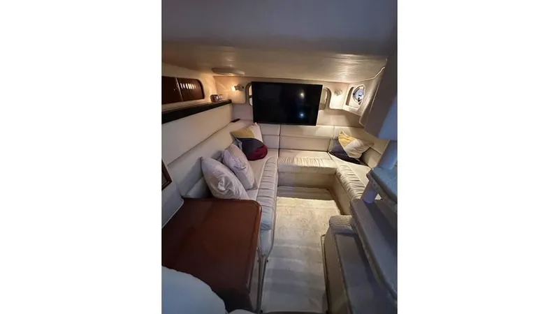 Slide: The Image of Interior of 2002 Sea Ray 340 Sundancer yacht with cozy seating and modern decor. - 10