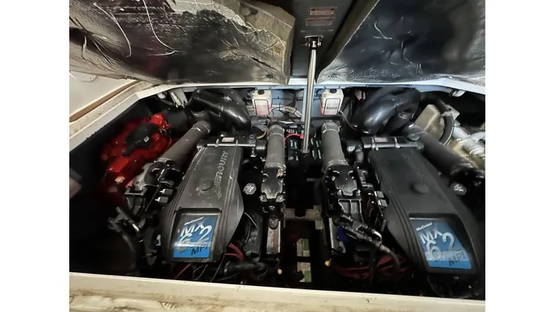 Slide: The Image of Engine compartment of a 2002 Sea Ray 340 Sundancer boat, showcasing dual engines. - 8