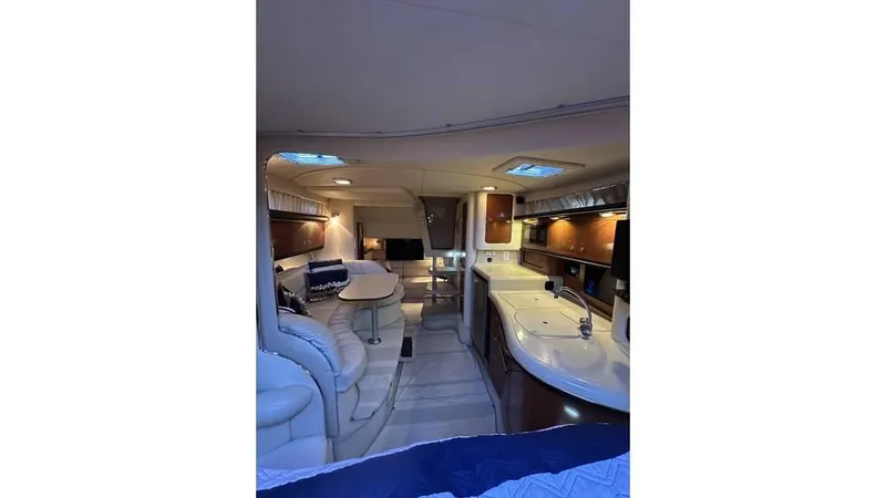 Slide: The Image of Luxurious interior of 2002 Sea Ray 340 Sundancer yacht with modern amenities and elegant design. - 9