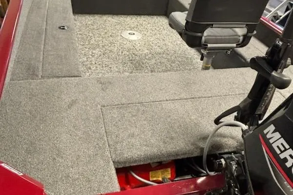 Slide: The Image of 2025 Tracker Super Guide V-16 T boat interior with gray carpet and seating. - 3