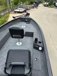 Slide: The Image of 2025 Tracker Super Guide V-16 T boat with seating and control panel on a paved surface. - 3