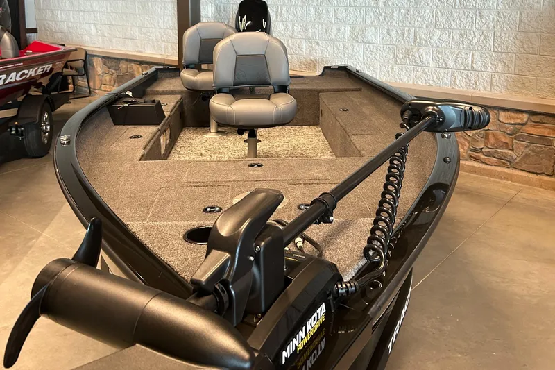 Slide: The Image of 2025 Tracker Super Guide V-16 T fishing boat with dual seats and trolling motor. - 2