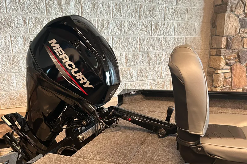 Slide: The Image of 2025 Tracker Super Guide V-16 T boat with Mercury outboard motor and cushioned seat. - 3