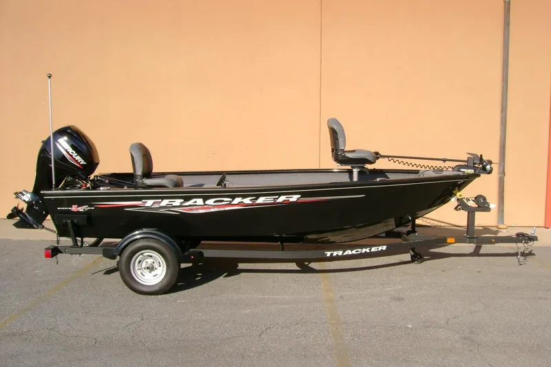 The Image of 2025 Tracker Super Guide V-16 T fishing boat on trailer, side view. - 0