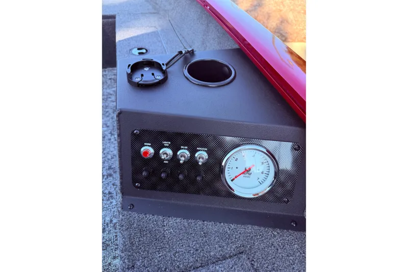 Slide: The Image of Control panel of 2025 Tracker Super Guide V-16 T boat with RPM gauge and switches. - 5