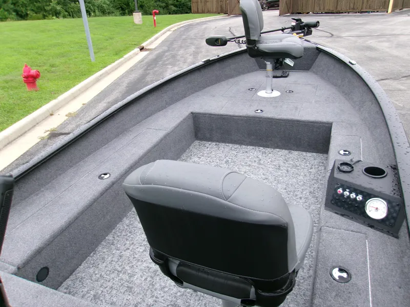 Slide: The Image of 2025 Tracker Super Guide V-16 T fishing boat interior with seating and control panel. - 4