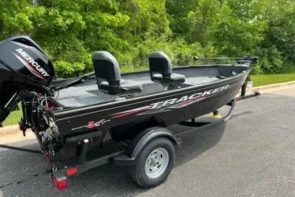 Slide: The Image of 2025 Tracker Super Guide V-16 T boat with Mercury engine on a trailer. - 2