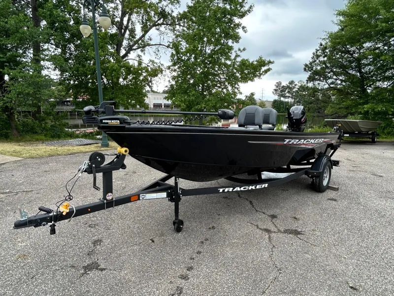 Slide: The Image of 2025 Tracker Super Guide V-16 T boat on trailer in outdoor setting. - 27