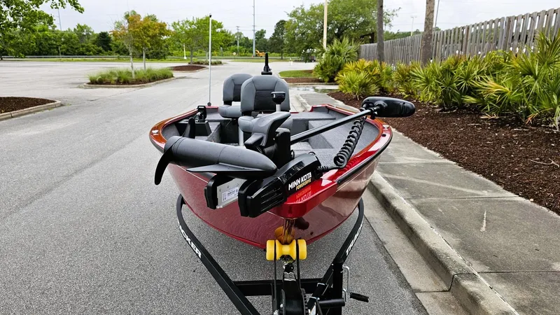 Slide: The Image of 2025 Tracker Super Guide V-16 T boat on trailer in parking lot. - 5