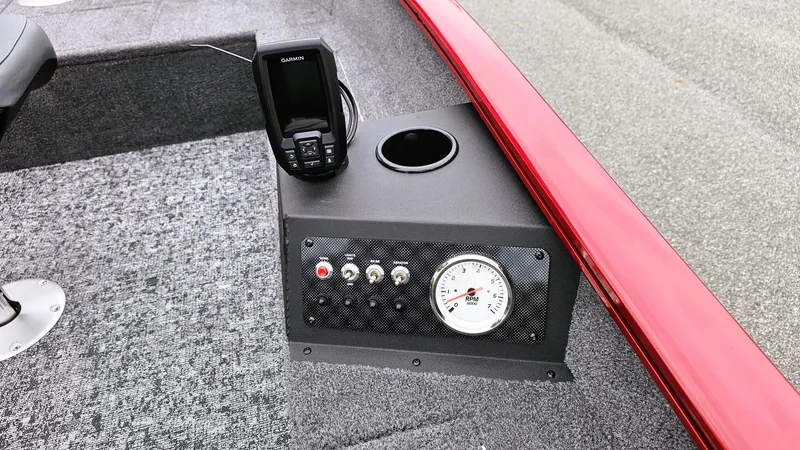 Slide: The Image of 2025 Tracker Super Guide V-16 T boat dashboard with gauge and electronic device. - 7