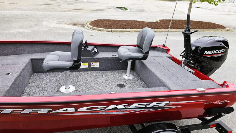 Slide: The Image of 2025 Tracker Super Guide V-16 T boat with Mercury motor, featuring two gray seats. - 8