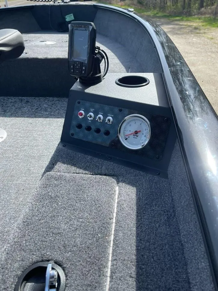 Slide: The Image of 2025 Tracker Super Guide V-16 T boat dashboard with gauge and controls. - 5