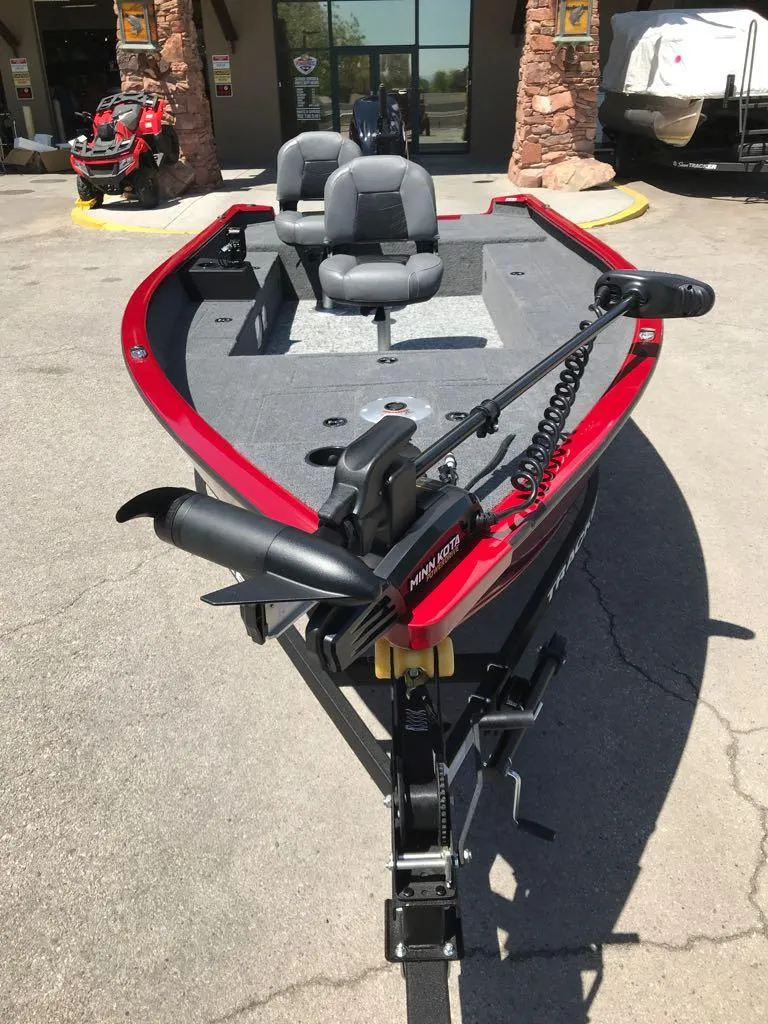 Slide: The Image of 2025 Tracker Super Guide V-16 T fishing boat with red trim and dual seats. - 3