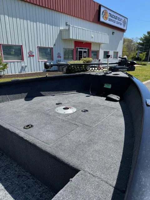 Slide: The Image of 2025 Tracker Super Guide V-16 T boat at service center, exterior view. - 6