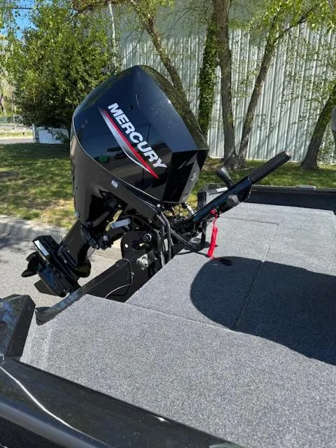 Slide: The Image of 2025 Tracker Super Guide V-16 T boat with Mercury outboard motor in a sunny outdoor setting. - 7