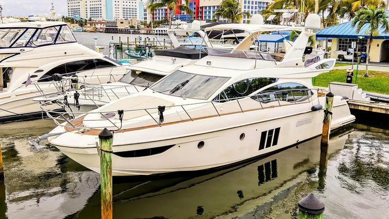 Slide: The Image of Azimut Fly 53 yacht, 2012 model, docked with palm trees in the background. - 1