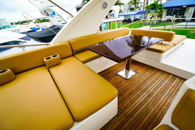 Slide: The Image of Helm of 2012 Azimut Fly 53 yacht with modern controls and tan seating. - 13