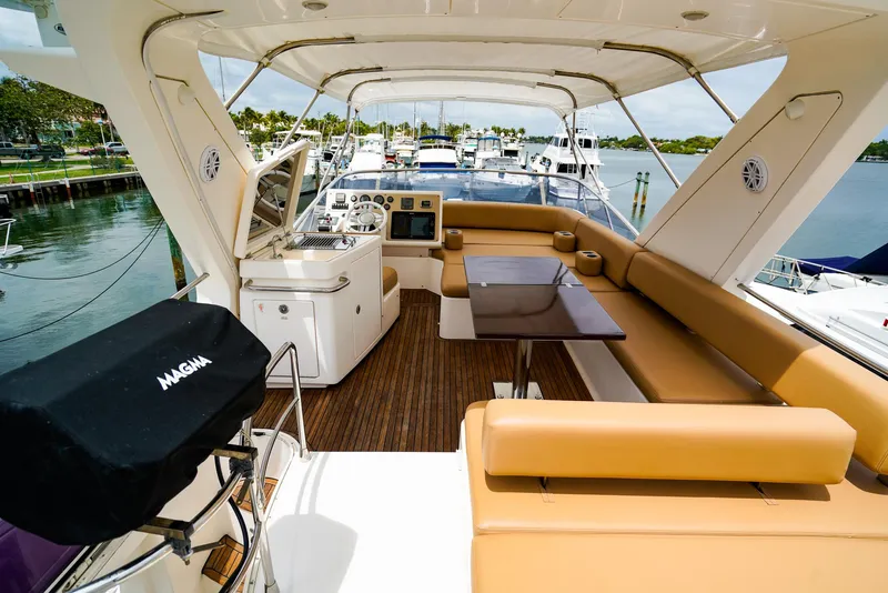 Slide: The Image of Luxurious seating area on 2012 Azimut Fly 53 yacht with wooden deck and table. - 15