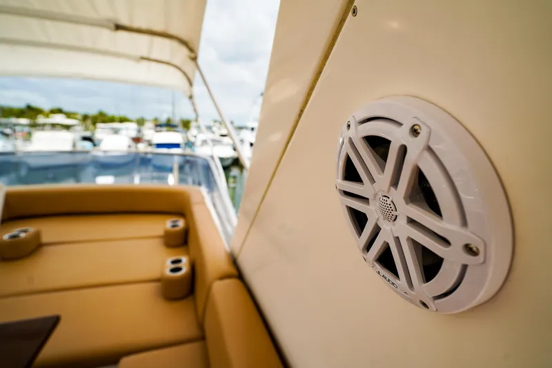 Slide: The Image of Luxurious 2012 Azimut Fly 53 yacht helm with tan seating and modern navigation controls. - 16