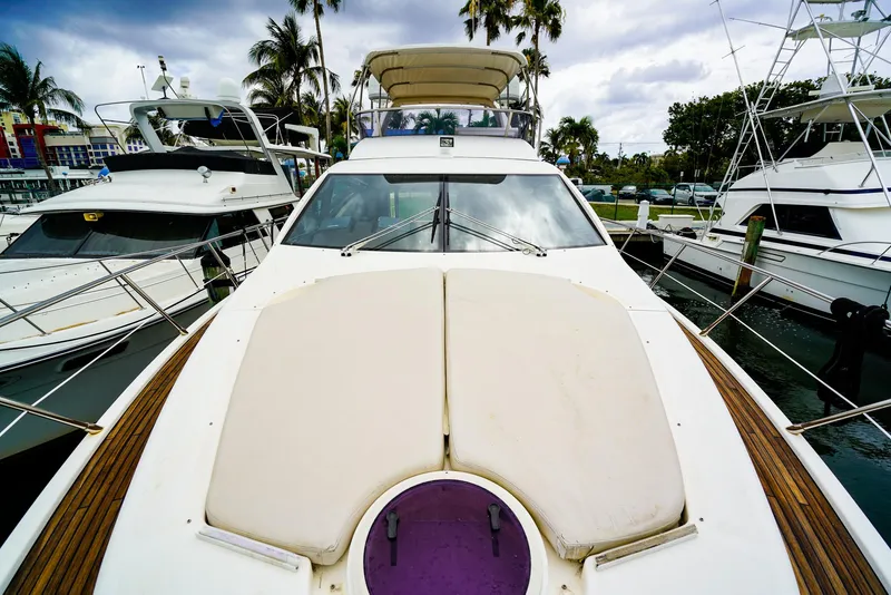 Slide: The Image of Azimut Fly 53 yacht docked at marina, showcasing sleek design and luxurious deck, 2012 model. - 21