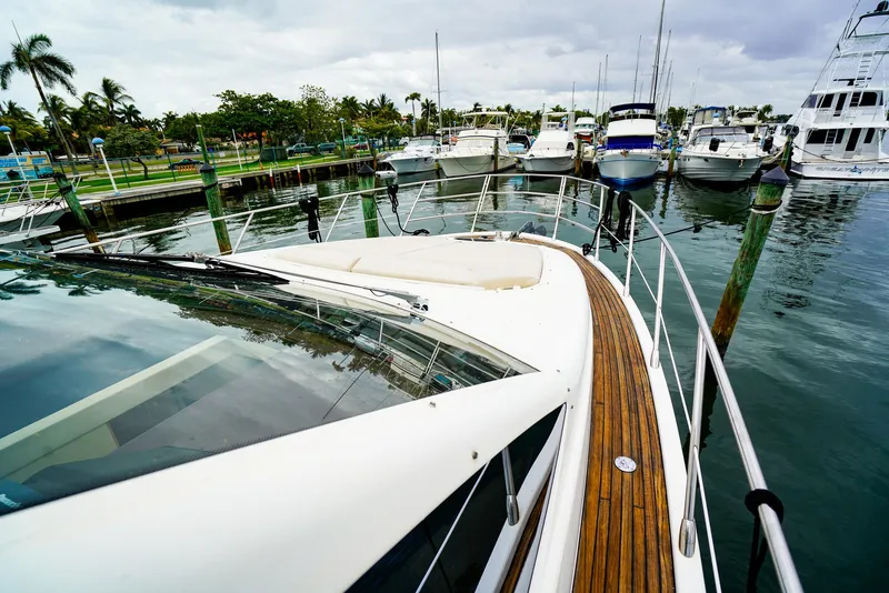 Slide: The Image of Bow of 2012 Azimut Fly 53 yacht with wooden deck and metal railings. - 22