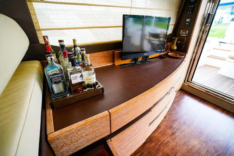 Slide: The Image of Luxurious interior of 2012 Azimut Fly 53 yacht with bar and TV setup. - 23