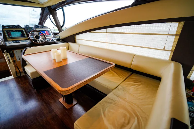 Slide: The Image of Luxurious interior of 2012 Azimut Fly 53 yacht with elegant seating and navigation controls. - 27