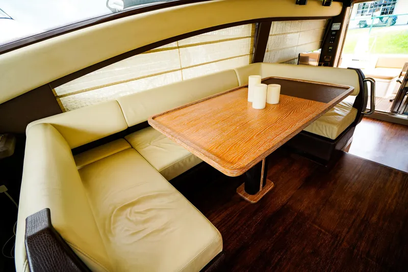 Slide: The Image of Luxurious interior of 2012 Azimut Fly 53 yacht with elegant seating and wooden table. - 29