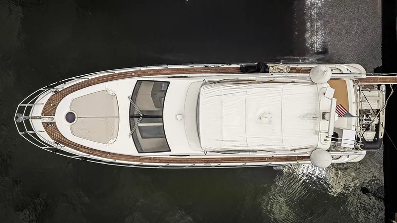 Slide: The Image of Luxury 2012 Azimut Fly 53 yacht docked at marina, surrounded by other boats. - 3