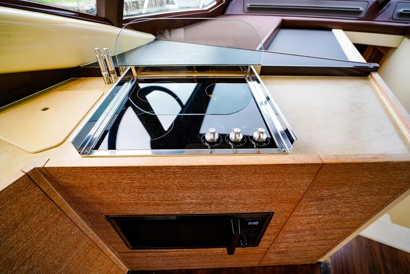 Slide: The Image of Modern kitchen area on a 2012 Azimut Fly 53 yacht with sleek stovetop. - 32