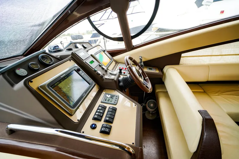 Slide: The Image of Luxurious 2012 Azimut Fly 53 yacht cockpit with advanced navigation controls and leather seating. - 33