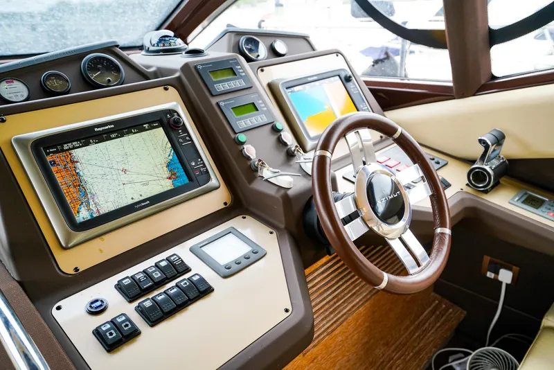 Slide: The Image of Cockpit of 2012 Azimut Fly 53 yacht with navigation screens and controls. - 34