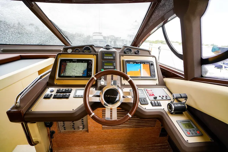 Slide: The Image of Cockpit of 2012 Azimut Fly 53 yacht with advanced navigation systems and steering wheel. - 35