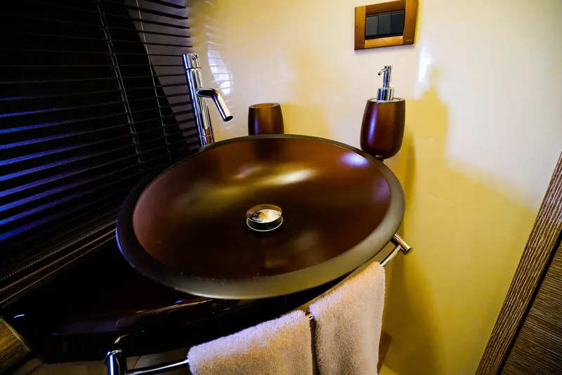 Slide: The Image of Luxurious bathroom sink on 2012 Azimut Fly 53 yacht, featuring modern fixtures and elegant design. - 38