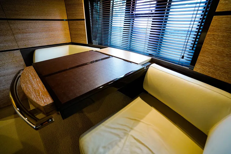 Slide: The Image of Luxurious interior of 2012 Azimut Fly 53 yacht with elegant seating and wooden table. - 42