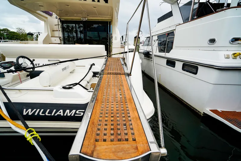 Slide: The Image of Azimut Fly 53 yacht, 2012 model, docked with wooden gangway and tender boat. - 48