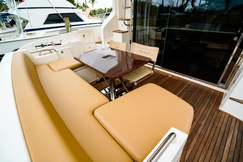 Slide: The Image of Luxurious 2012 Azimut Fly 53 yacht deck with elegant seating and wooden flooring. - 6