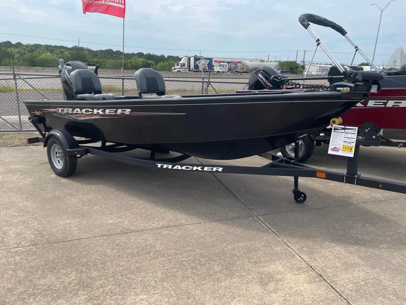 The Image of 2025 Tracker Super Guide V-16 T boat on trailer, displayed outdoors. - 0