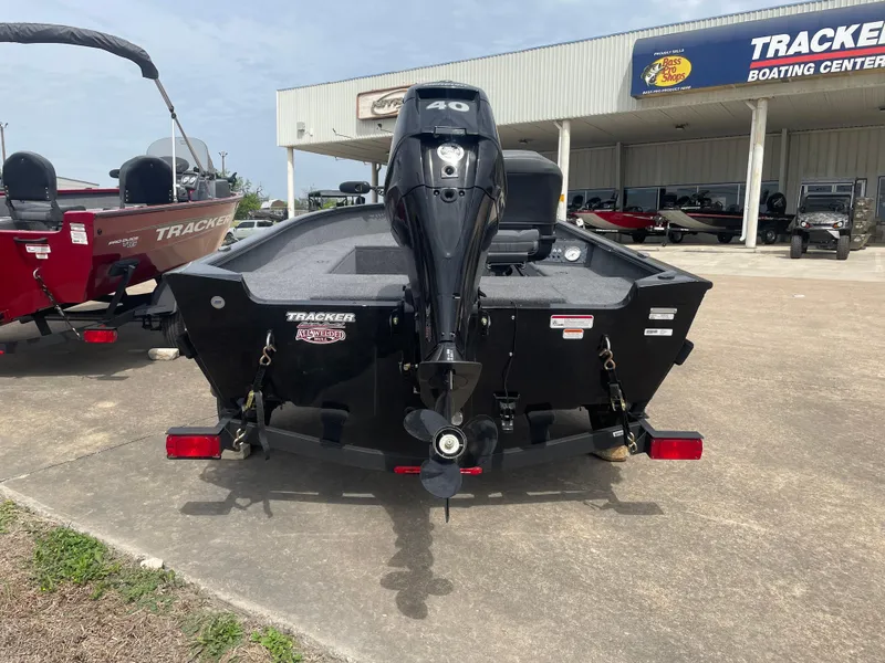 Slide: The Image of 2025 Tracker Super Guide V-16 T boat with 40 HP engine at dealership. - 5