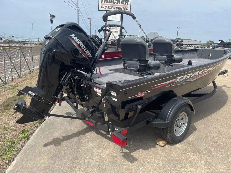 Slide: The Image of 2025 Tracker Super Guide V-16 T boat with Mercury engine on trailer. - 6