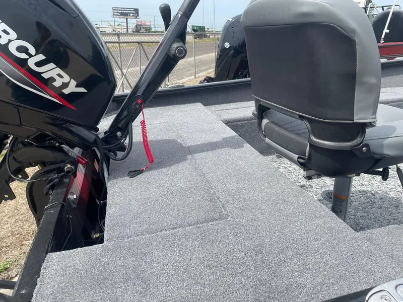 Slide: The Image of 2025 Tracker Super Guide V-16 T boat interior with Mercury engine and seating. - 7