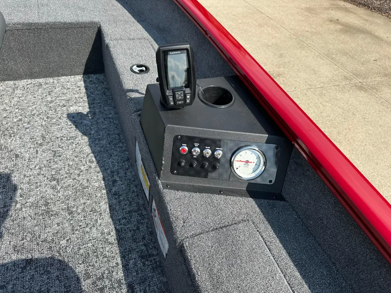 Slide: The Image of 2025 Tracker Super Guide V-16 T boat dashboard with gauges and fish finder. - 4