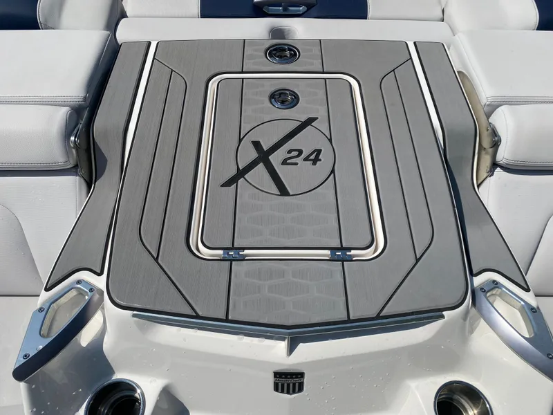 Slide: The Image of 2021 MasterCraft X24 boat deck with sleek design and logo detailing. - 12
