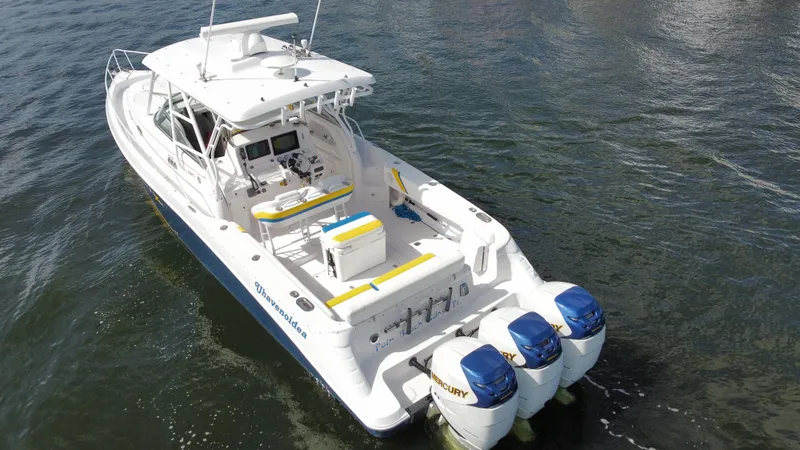 Slide: The Image of 2006 Donzi 38 ZSF boat with triple Mercury engines on water. - 10