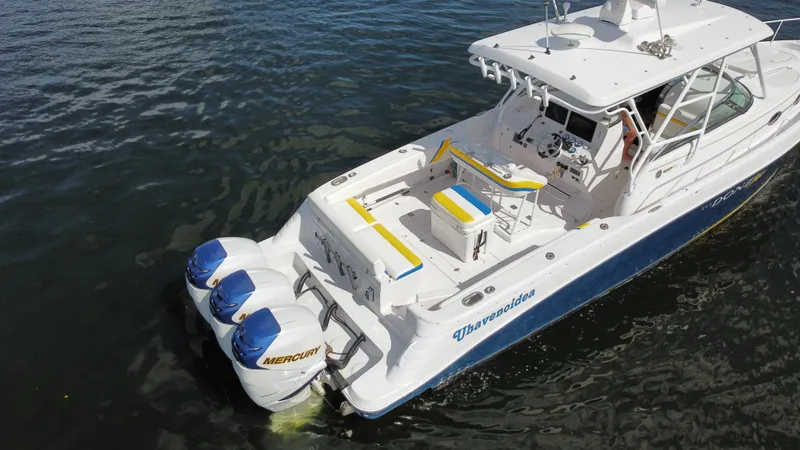 Slide: The Image of 2006 Donzi 38 ZSF boat with twin Mercury engines on water. - 11